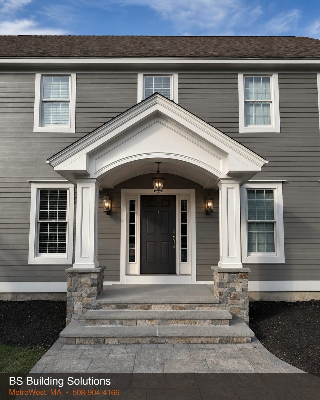 After: finished porch with stone columns and steps — Paxton, MA